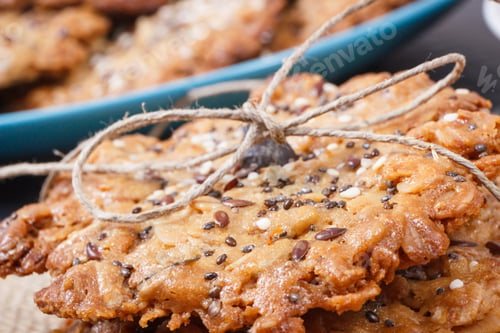 Preview: Fresh baked oatmeal cookies with honey and healthy seeds. Delicious crunchy dessert