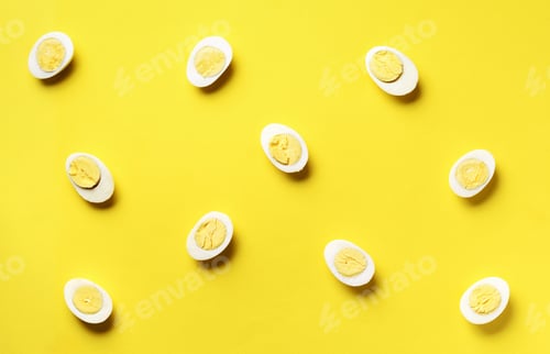 Preview: Food concept with boiled eggs pattern on yellow background. Top view. Creative pattern in minimal