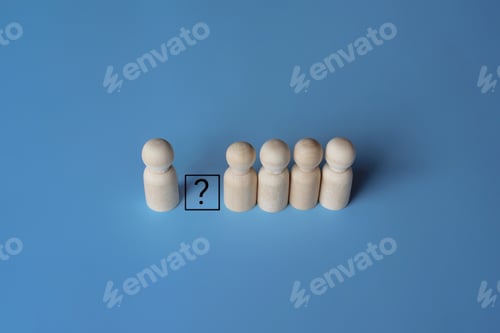 Preview: Wooden dolls and question mark.