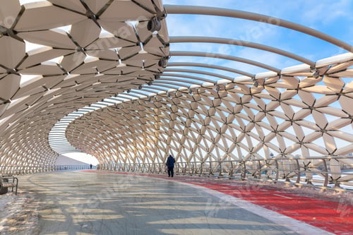 Preview: Modern architectural urbanistic Atyrau fish bridge across Ishim river. Pedestrian bridge with