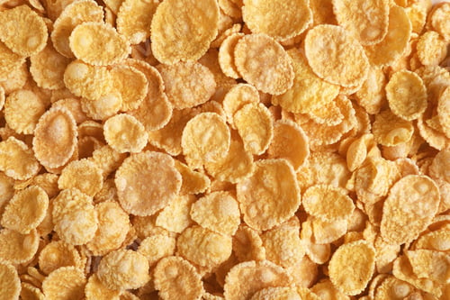 Preview: Crispy cornflakes as background, top view. Healthy breakfast
