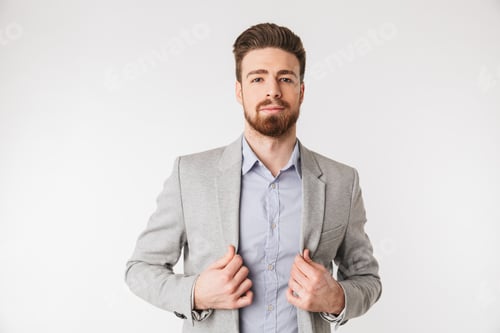 Man in Blazer Poses in Front of White Background