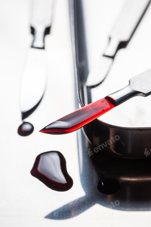 Preview: Surgical steel scalpels on white stainless steel table