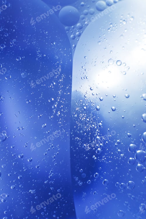 Preview: Oil bubbles close up. circles of water macro. abstract light blue background