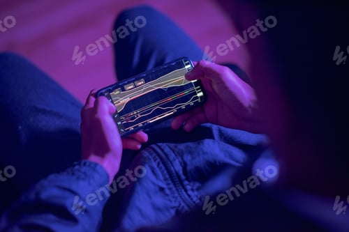 Preview: Person using mobile app to trade on markets