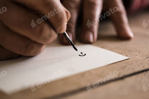 Preview: Person using a nib pen and ink to do calligraphy