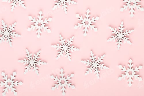 Preview: White snow decorations on a pink background.