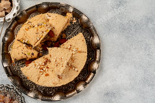 Preview: Close up photo of halva dessert on silver plate
