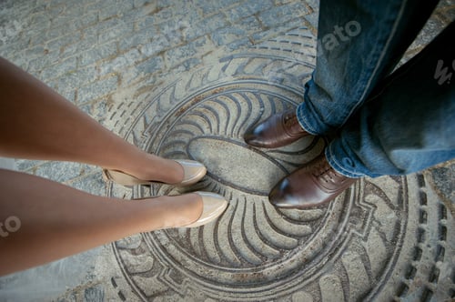 Preview: Legs man and woman, couple standing on the hatch