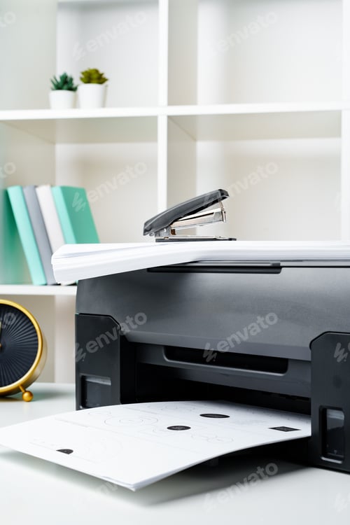 Preview: Workplace with modern printer and clock in the office