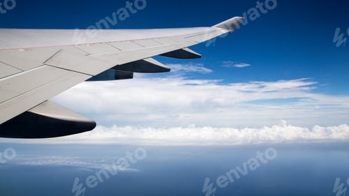 Preview: Traveling by air. Plane wing in flight. Beautiful sky and wonderful clouds