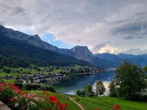 Preview: Aerial view of blooming fields and houses near the shore of Grundlsee, Austria