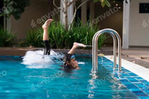 Preview: Children swimming in the pool.