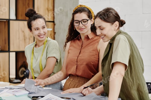 Preview: Contemporary young female fashion designers choosing textile for one of items