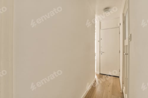 Preview: an empty hallway with white walls and a door