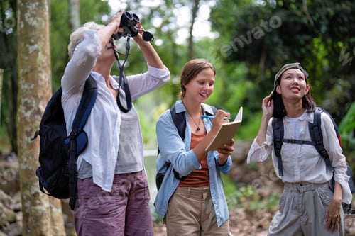 Preview: Backpack tourist travel outdoor adventure bird study using binoculars looking and record to book