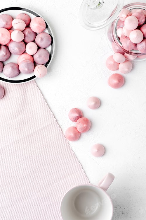 Preview: Multicolored meringues in purple and gently pink colors on a whi