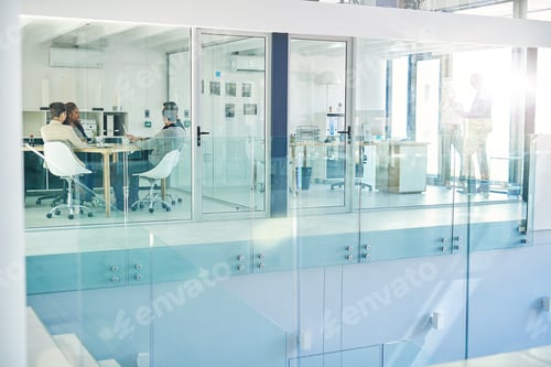 Preview: Success is the product of teamwork. Shot of corporate colleagues working together in their office.