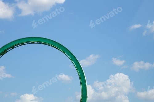 Preview: Roller coaster loop against blue sky colorful minimalism