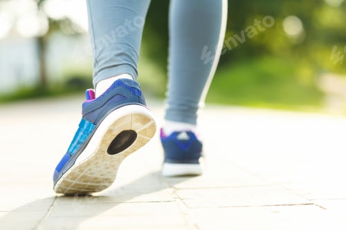 Preview: Closeup of female sport fitness runner getting ready for jogging