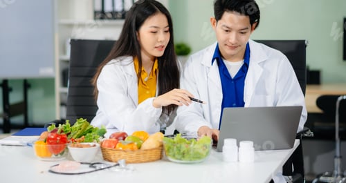Preview: Doctors sharing fresh vegetables, promoting health and nutrition. Ideal for wellness, healthcare,