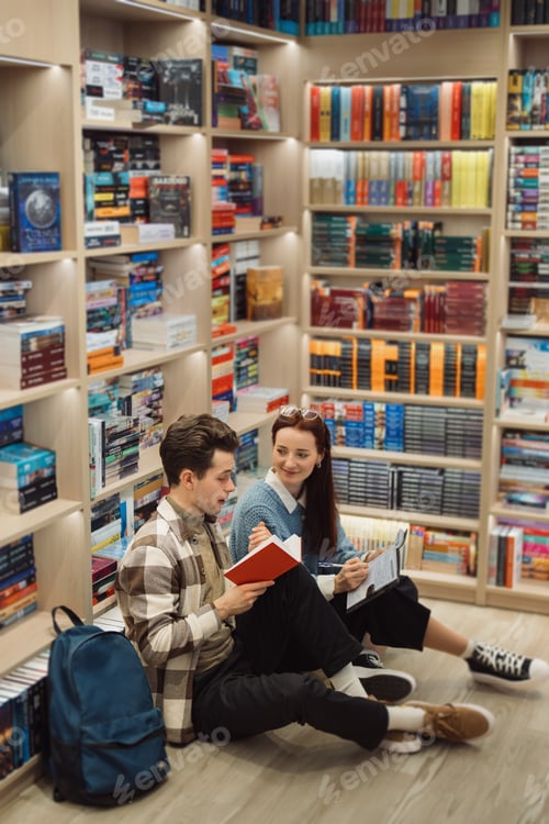 Preview: Young couple enjoys reading together in a cozy bookstore