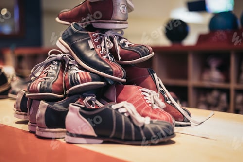 Preview: Bowling shoes of different sizes on the table