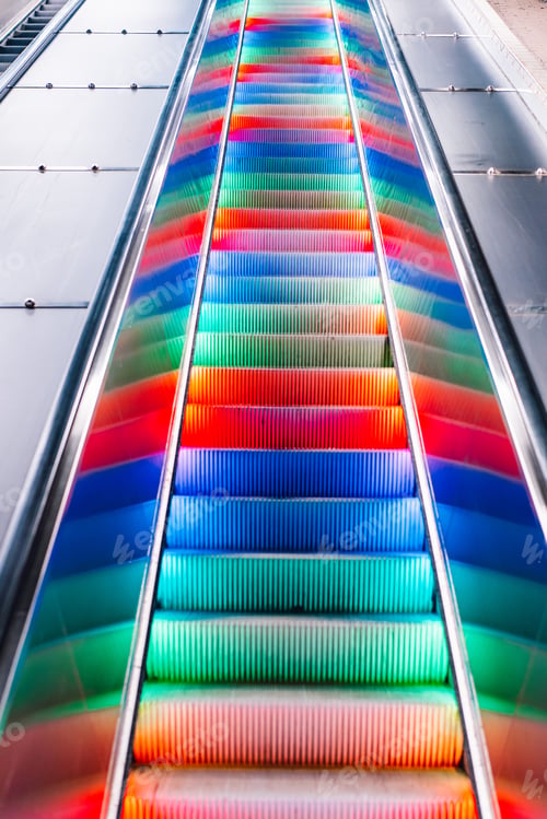 Preview: Escalator with multi-colored LED rainbow lights. Subway station in Stockholm, Sweden