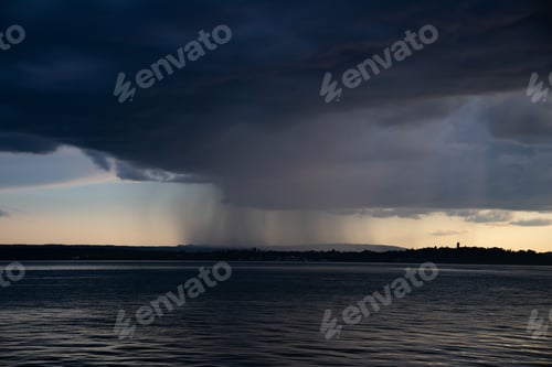 Preview: Heavy dark fast moving thunderstorm clouds over lake Constance, Germany