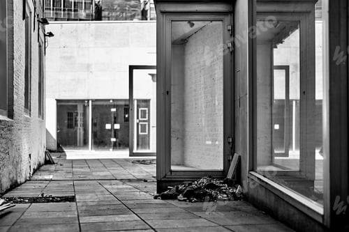 Preview: Grayscale of an old abandoned entrance to a building.