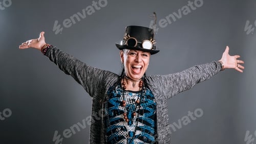 Preview: middle age woman with alternative style expands her arms with expression of joy and vitality