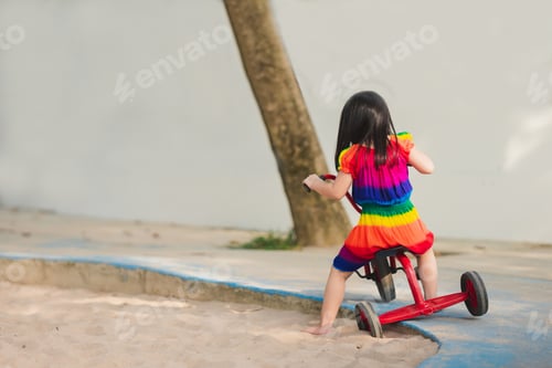 Preview: Child was solving problem of bicycle getting on road to continue riding.