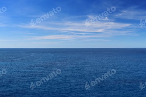 Preview: Tranquil scenery of the horizon on the azure ocean and the blue sky in daylight