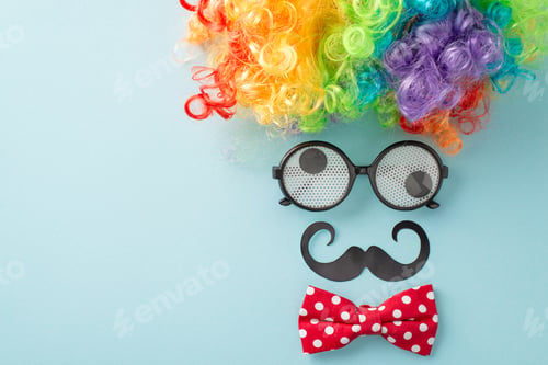 Preview: April Foolery display: top view photo with humorous goggles, buffoon's wig, neckwear