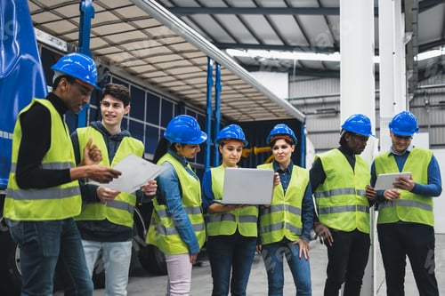 Preview: Team of multiracial engineers working in robotic factory - Tech industrial concept