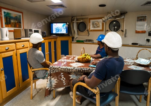 Preview: Seamen crew onboard a ship or vessel having fun watching TV