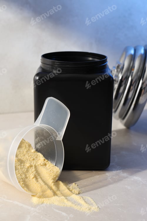 Preview: Black plastic jar, measuring cup with powder and dumbbell on light background
