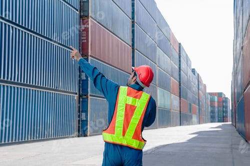 Preview: Container yard worker checking container at container yard warehouse.