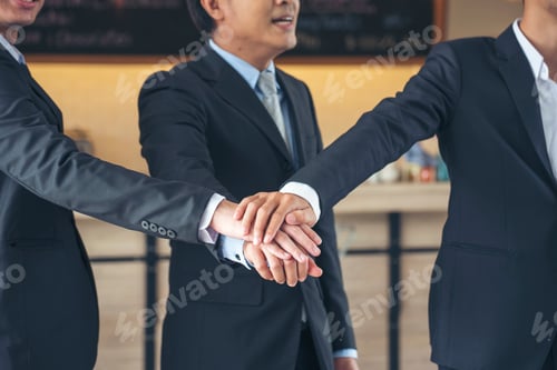 Preview: Close up hands Diverse multiethnic Partners team together. Teamwork group of multiracial people