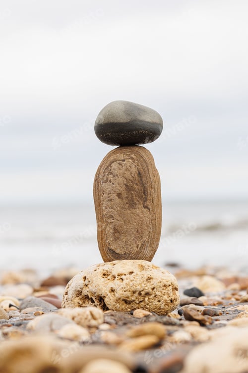 Preview: Vertical shot of big rocks at the coast of an ocean