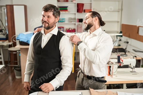 Preview: Tailor Measures a Man for a Custom Suit