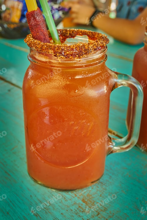 Preview: Michelada served in mason glass with tamarind candy garnish