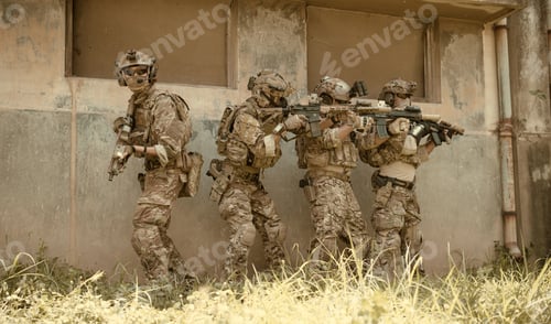 Preview: Professional marine soldiers training with weapon on a military range.