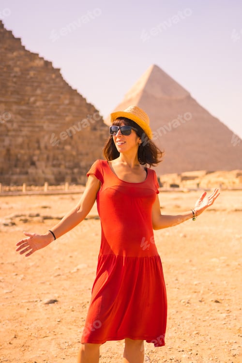 Preview: Portrait Of A Young Girl In Red Dress At The Pyramid Of Cheops The Largest Pyramid. The Pyramids Of