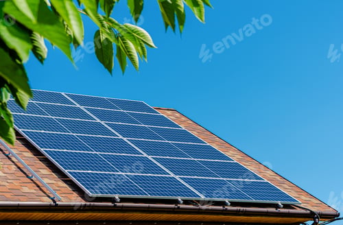 Preview: Solar panels on the roof. Green energy concept. Copy space