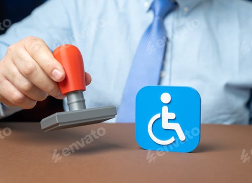 Preview: An official stamps an application for disability status. Securing legal recognition