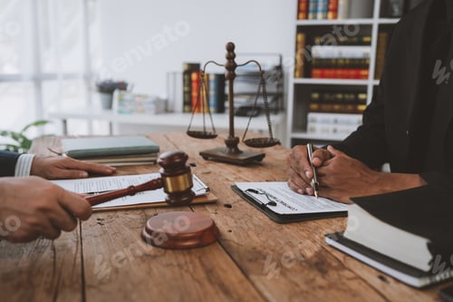 Preview: An attorney or legal advisor is carefully reading the validity of investment documents and signing a