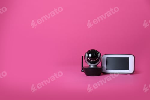 Preview: Modern CCTV security camera and monitor on color background. Space for text