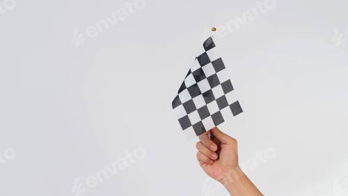 Preview: Hand is hold F1 flag or chequered flag on white background