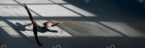 Preview: Young Gymnast Performing on Wide Banner with Copy Space
